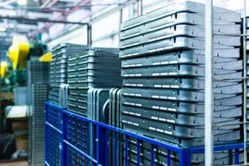 Steel sheets deposited in stacks in packs at the warehouse of metal products. Weathered metals sheet for construction. Metal corrosion