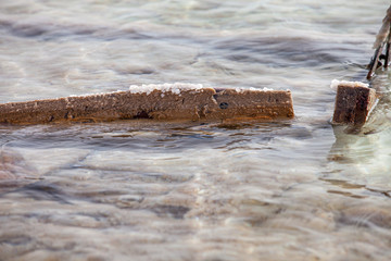 beam into dead sea is covered by salt crystal