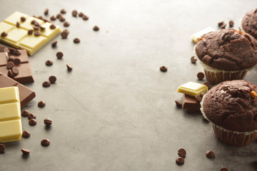 Chocolate chip muffin with chocolate bar. White and dark chocolate. Copy space.