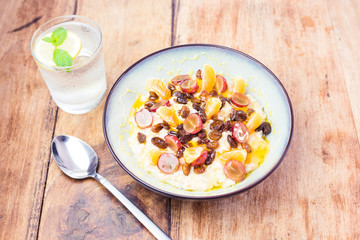 Eat healthy food in order to be healthy - oatmeal and fruit, water