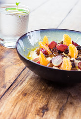 Diet for active people - porridge with fruit and water with lemon