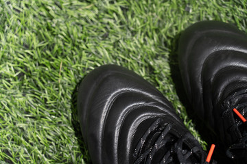 football stud shoes on artificial grass football field