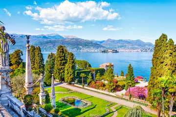 Beautiful Isola Bella island with flower garden on Lake Lago Maggiore in the background of the Alps...
