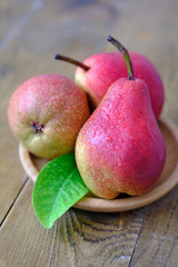 red pears on wooden table