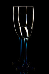 Elegant picture of glasses with clear water on a black background