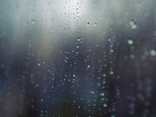 Naklejka na ściany i meble ..Raindrops on the surface of window glass with a blurred background.