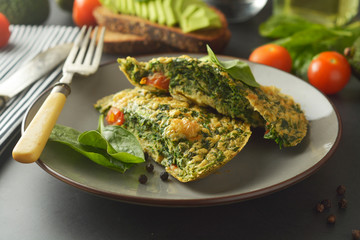 Omelet with spinach leaves. Healthy omelette for lose weight. Healthy food.