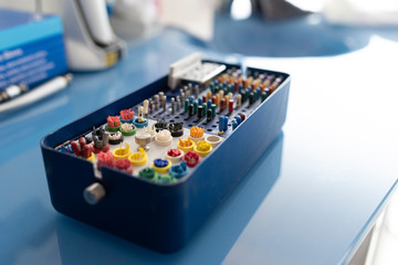 Closeup dental drills assortment on table in dental clinic.
