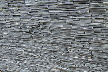 A Background Image of a Stone Slate Built Wall.