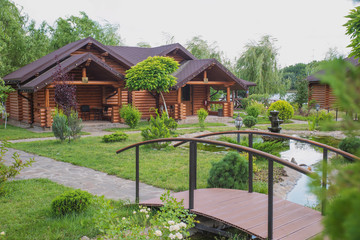 Country cottages with log and timber in the green area. cozy eco-friendly houses made of natural wood, bungalows for families