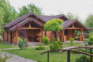 Country cottages with log and timber in the green area. cozy eco-friendly houses made of natural wood, bungalows for families