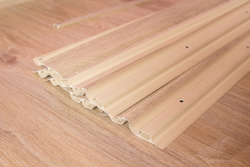 Baseboard PVC on the floor,floor repair, lie new plastic baseboard