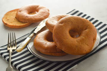 Bagels isolated on bright board for breakfast. Pastry.