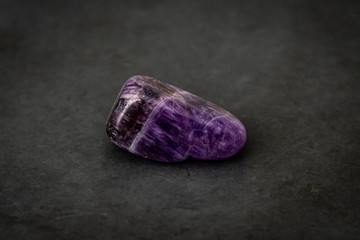 Fluorite precious gemstone with smooth surface purple and grey tones