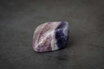 Fluorite precious gemstone with smooth surface purple and grey tones