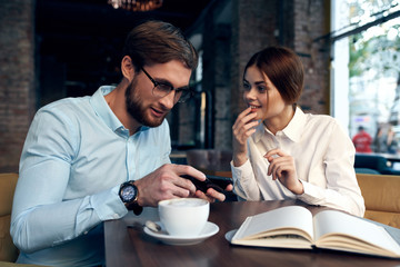 young couple having breakfast in cafe