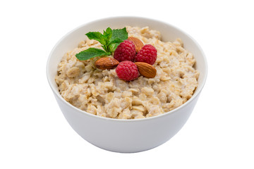 Oatmeal with almonds and raspberries and mint isolated on white