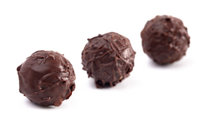 Dark Chocolate Truffles Filled with Caramel on a White Backgroun