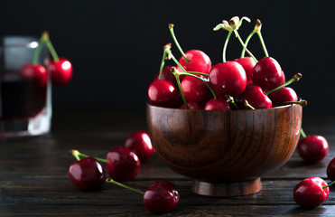 A Bowl Of Tasty Cherries On Wooden Background