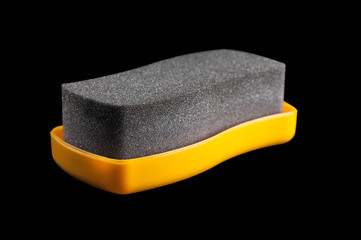 sponge for cleaning shoes on a black background, isolate