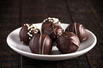 Chocolate Truffles on a Rustic Wooden Table