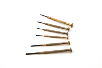 Small screwdrivers on white background