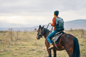 young girl riding a horse