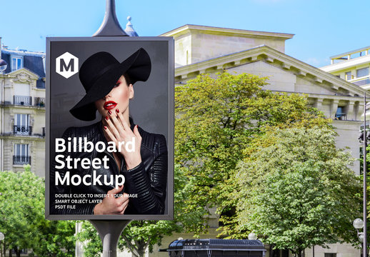 Billboard on City Street with Trees Mockup