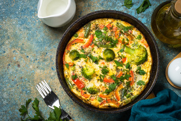 Frittata with fresh vegetables in the skillet.