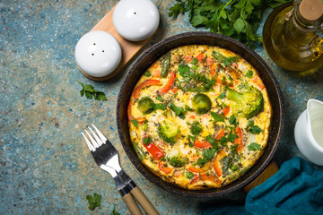 Frittata with fresh vegetables in the skillet.