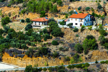 Fototapeta na wymiar Mountain slopes and red roof village