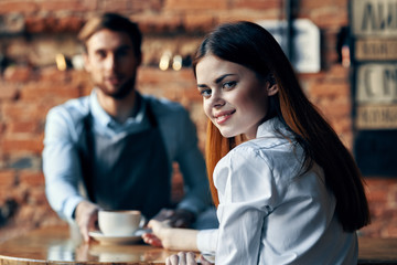 young couple drinking coffee in cafe