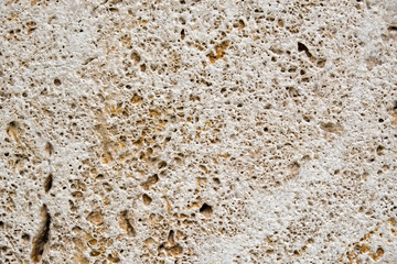 Background of old stone. Limestone is a sedimentary, detrital rock of organic, less often chemogenic origin, consisting of calcium carbonate (CaCO3) in the form of calcite crystals.