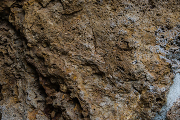 Background of old stone. Limestone is a sedimentary, detrital rock of organic, less often chemogenic origin, consisting of calcium carbonate (CaCO3) in the form of calcite crystals.