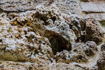 Background of old stone. Limestone is a sedimentary, detrital rock of organic, less often chemogenic origin, consisting of calcium carbonate (CaCO3) in the form of calcite crystals.