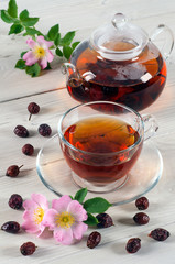 Cup and teapot of rose hip tea