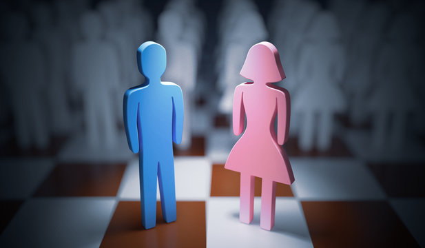 Man and woman standing on chess board. Gender equality concept.