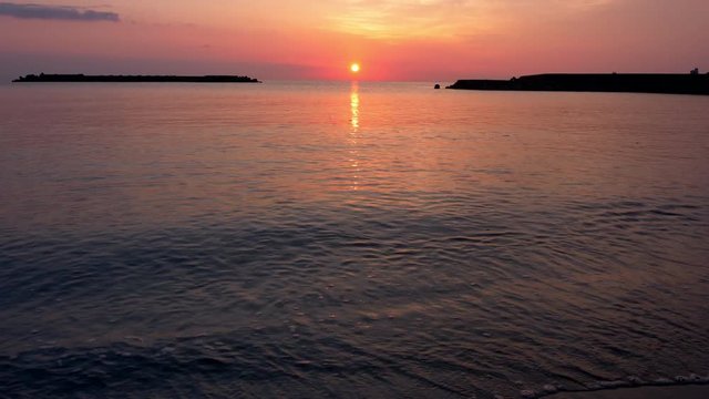 Sunrise over a Sea (tilt up)