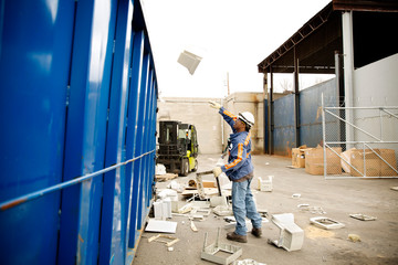 Fototapeta premium Industrial worker recycling computer parts
