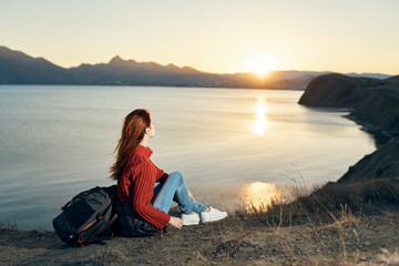 Fototapeta premium woman sitting on the beach