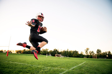 Portrait of American football player playing in field © Cavan for Adobe