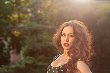 Naklejka premium Elegant young woman posing in the park.