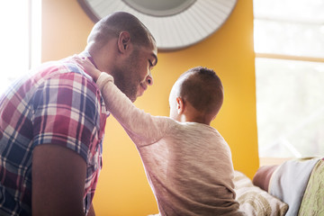 Obraz premium Father and son sitting at home