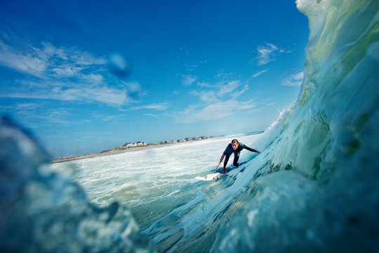 Woman surfing in sea