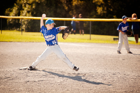 Player throwing ball in field