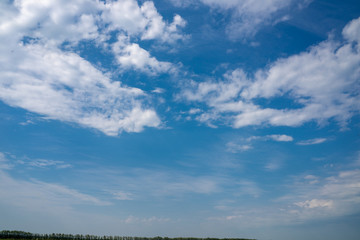 clear blue sky with plain white cloud with space for text background © Алексей Закиров