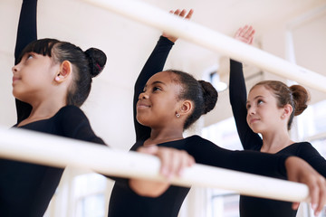 Child ballet dancers practicing in studio © Cavan for Adobe