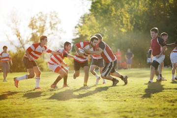 Fototapeta premium Rugby team tackling during scrimmage