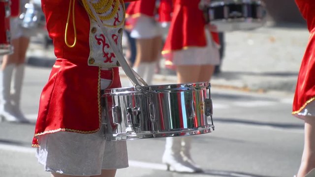 Close-up of female hands drummers are knocking in the drum of their sticks. Young drummers line up and beat the melody