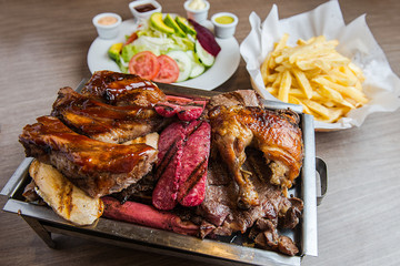 Delicious grill with french fries